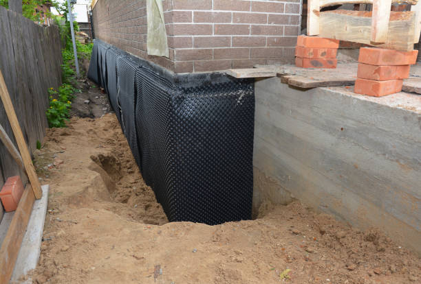 Happy homeowners after waterproofing job in Cayuga